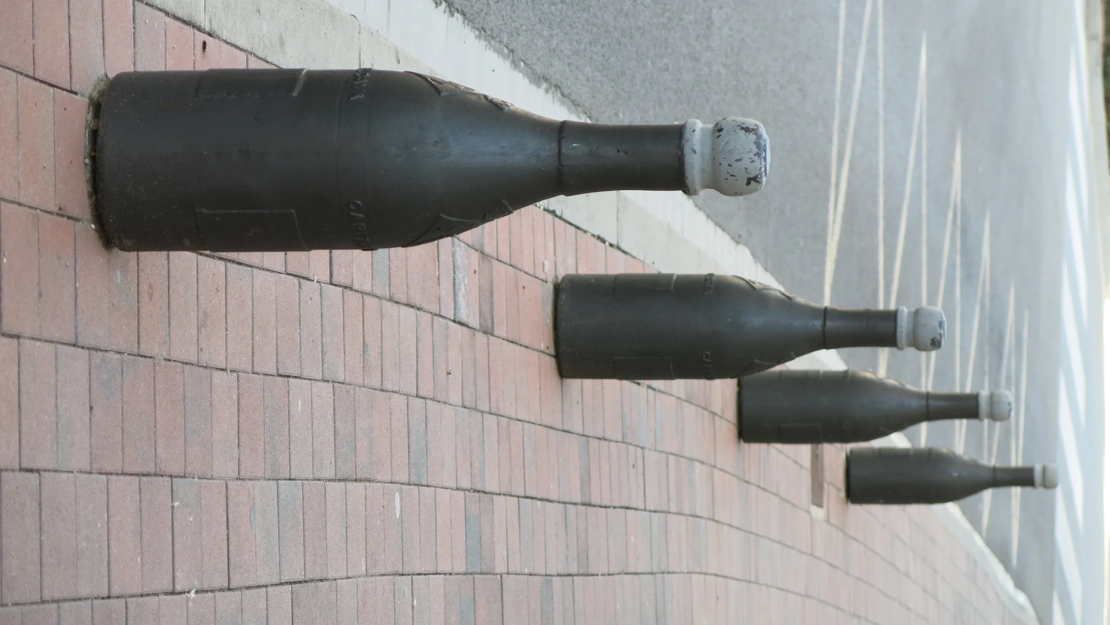 File:262 Pilons en forma d'ampolla de cava davant les caves Freixenet (Sant Sadurní d'Anoia).jpg