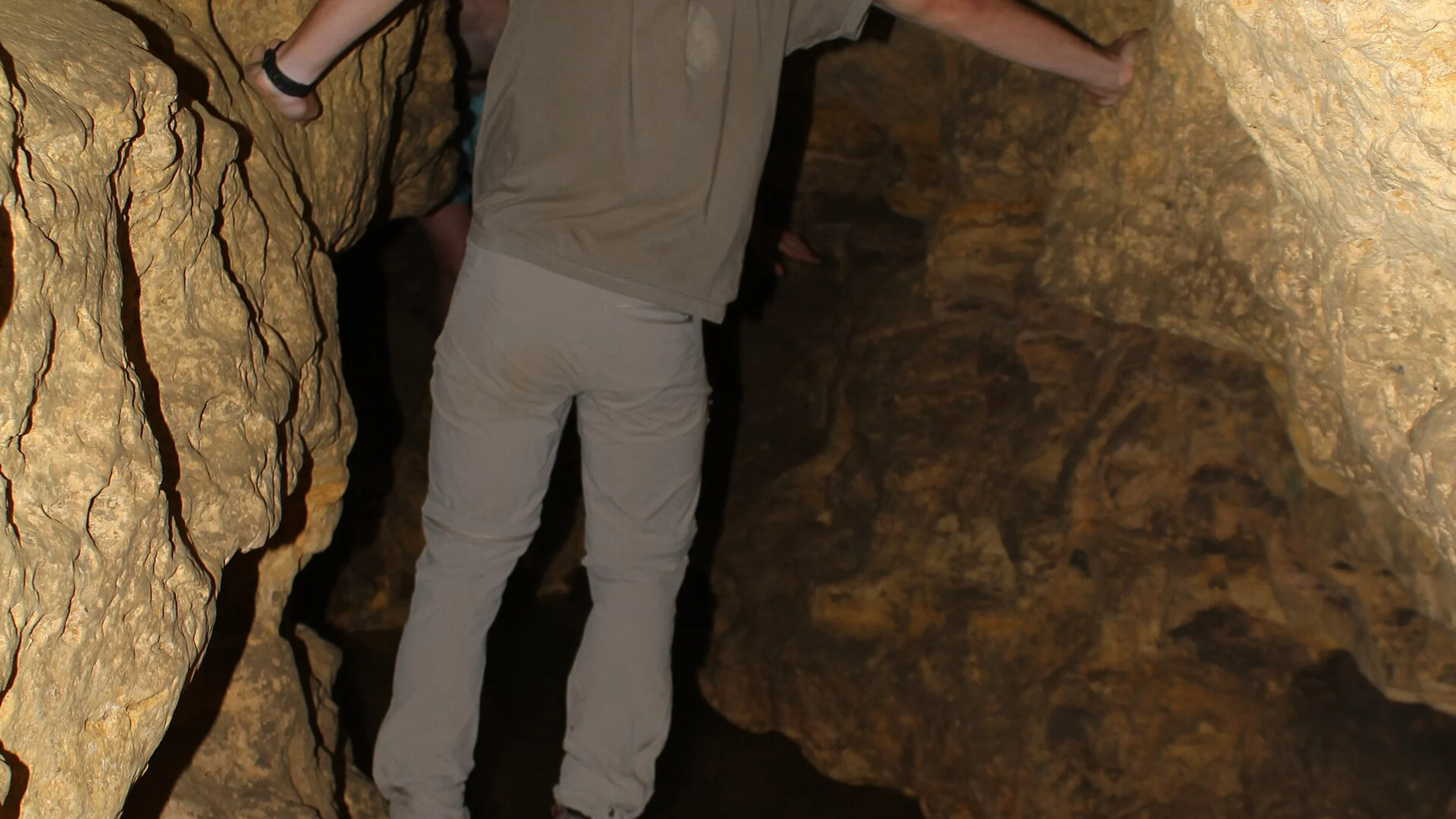 Progress in a natural cave with an instructor.