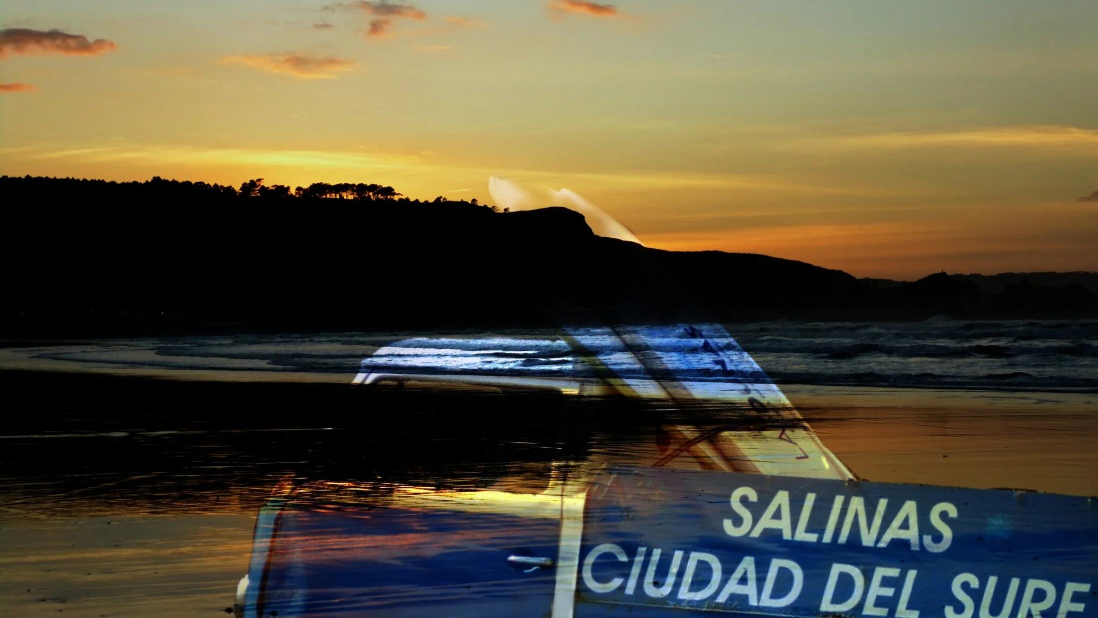 Surfer at sunset in Salinas